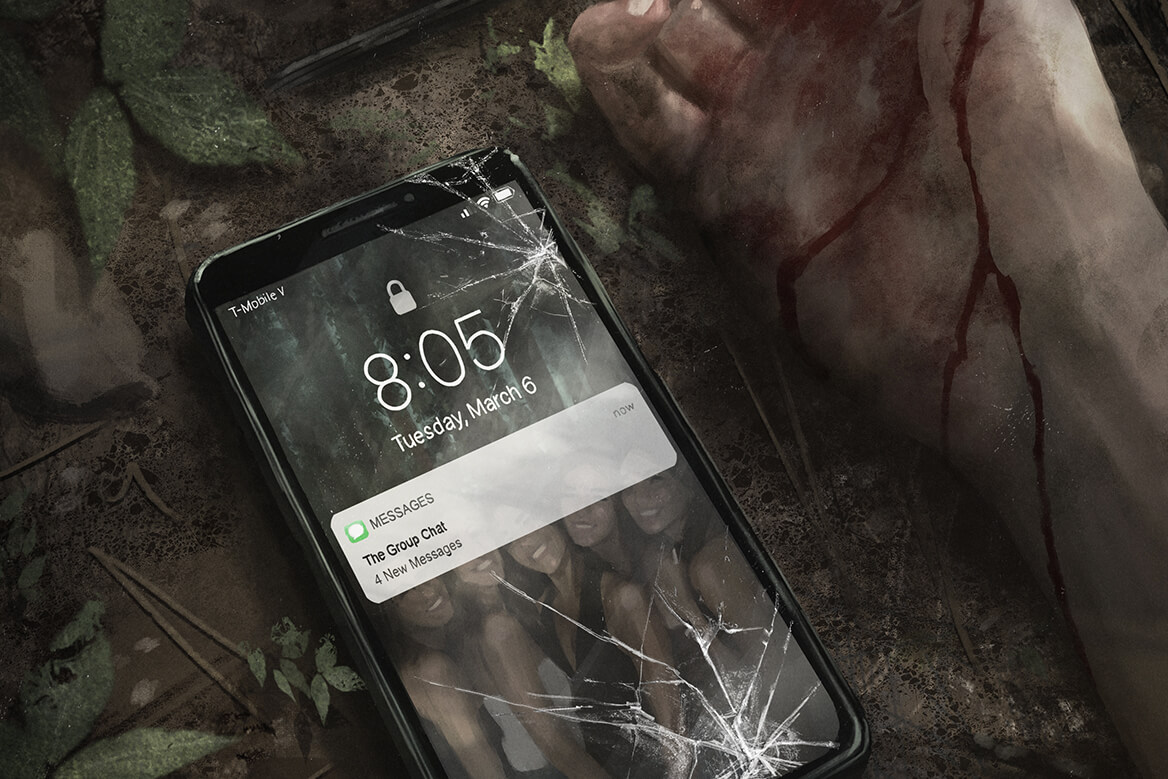 a cracked phone lying on rocky ground beside a bloodied outstretched hand